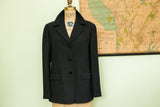 Vintage 80s Giorgio Armani suit jacket in dark gray textured fabric with notched lapels.