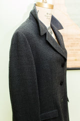 Vintage 80s Giorgio Armani suit jacket, dark grey herringbone weave, lapel, and front buttons.