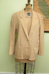 Vintage Abercrombie cashmere suit jacket in tan, seen from a three-quarter angle.