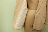 The crinkled ivory lining inside the sleeve of the vintage cashmere blazer.