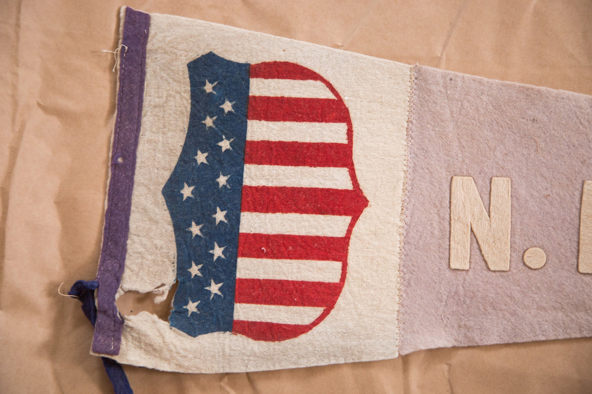 Hole present in this antique NE fair felt flag pennant 