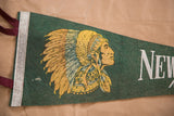 Green felt pennant, gold and blue Native American headdress, partial white 'New' text.