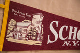 Detailed graphic of the Old Stone Fort on a vintage maroon and cream felt pennant.
