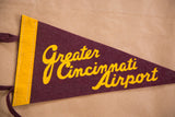 Yellow vertical border, maroon felt, and tie strings of the vintage airport flag.