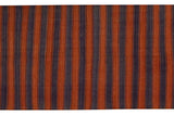 Rust and royal blue hand-woven vertical stripes of the vintage Kilim runner.