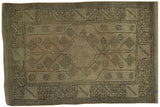 Vintage Oushak rug, beige and antique ivory field with charcoal geometric patterns.