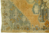 Vintage Oushak rug with jagged pumpkin rust and light teal color transition.