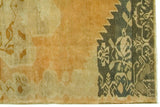 Oushak rug corner with pumpkin rust abrash field and dark teal floral border.