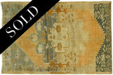 Heavy abrash and dynamic design of a vintage Oushak rug in pumpkin rust and teal.