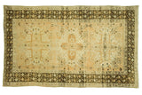 Vintage Oushak rug with peachy gold field and chocolaty charcoal triple medallion geometric design.