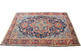 Unusual blue field vintage Heriz rug, mint green medallion, saturated floral patterns.