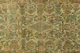 Vintage Kerman rug with curvilinear central medallion and muted floral bouquets.
