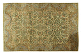 Vintage Persian Kerman rug, traditional small medallion and allover floral bouquet in a muted palette.