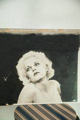 Vintage Jean Harlow street art top edge, with visible adhesion to board.