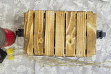 Unfinished wooden slats with natural grain and metal bolts for the mini cart kit.