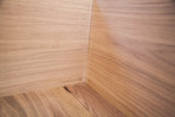 Clean, handcrafted rabbet joinery inside the unfinished walnut sidecar bench.