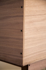 Corner detail of the walnut sidecar showing rabbet joints and smooth, natural wood grain.
