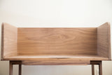 Flowing grain pattern of the natural, unfinished walnut wood sidecar interior.