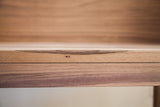 Close-up of the sidecar's solid walnut wood showing its natural grain and joinery.