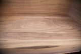 Detailed view of the smooth, unfinished walnut grain inside the handmade sidecar.