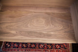 Detail of the walnut wood's rich grain and the sidecar's corner joinery.