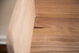 Interior corner of the walnut sidecar, showing the clean lines and precise handcrafted joinery.