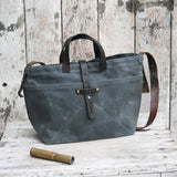 Peg and Awl Slate waxed canvas tote bag with reclaimed leather straps and brass hardware.